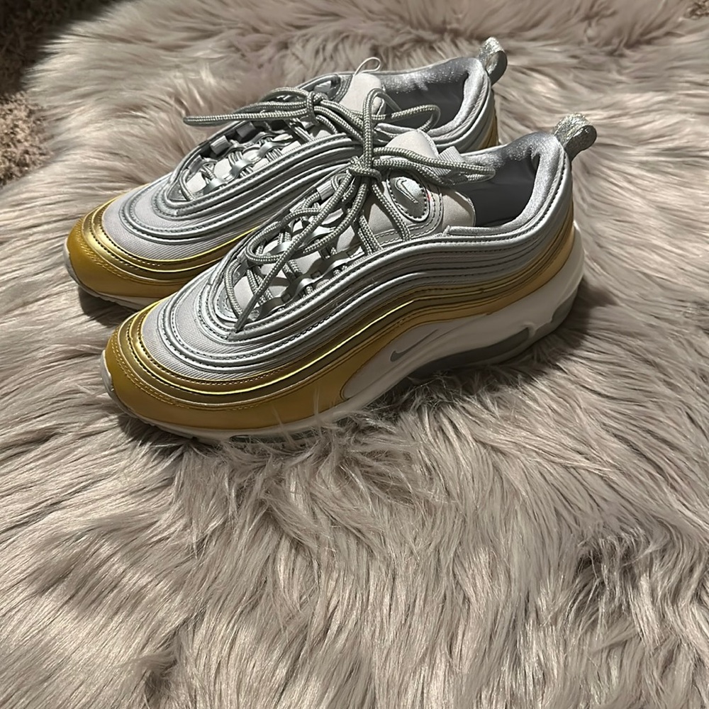 Women size 8.5 Nike sneakers gray/silver, gold and white in great condition